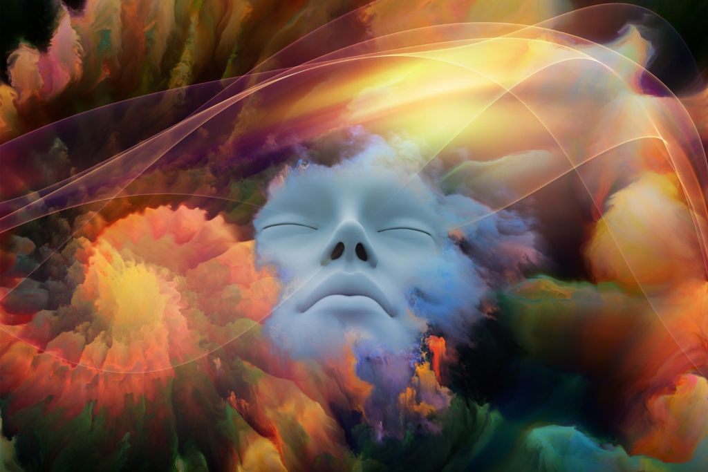 Rostro humano con ojos cerrados emergiendo entre nubes abstractas y coloridas, rodeado de tonalidades cálidas y formas difusas, simbolizando la conexión entre los sueños, las creencias y la imaginación